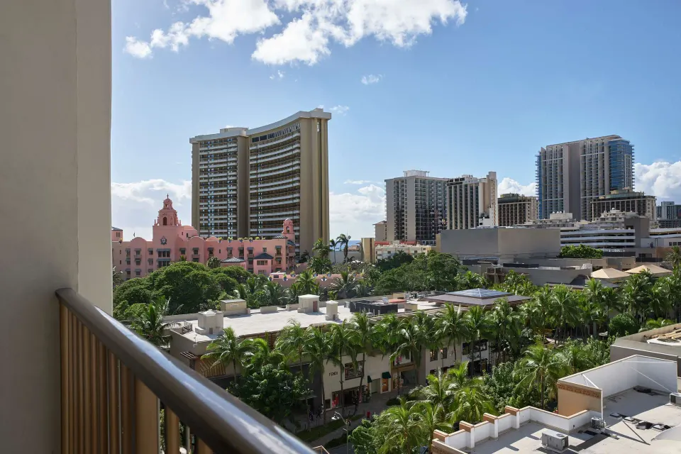 Balcony view of Waikiki buildings and palms at OUTRIGGER Waikiki Beachcomber Hotel.