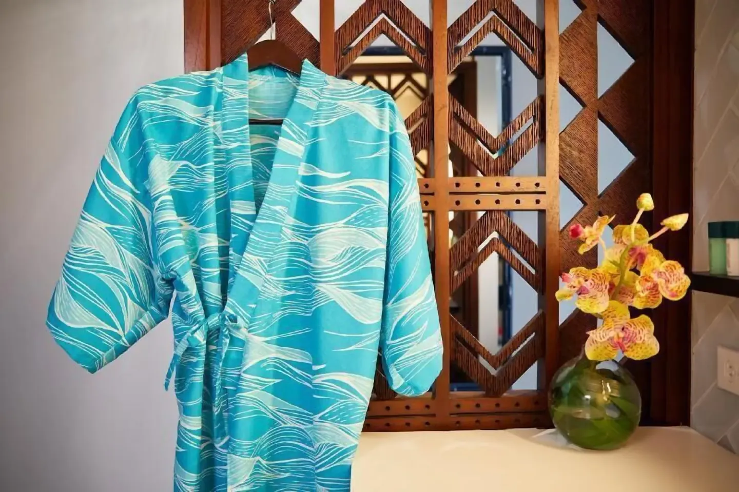 Blue patterned robe hanging in a Partial Ocean View room at Outrigger Waikiki Beachcomber Hotel.