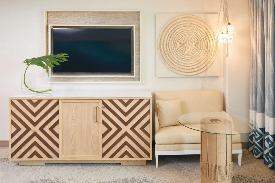 Guest room seating and media wall at OUTRIGGER Waikiki Beachcomber Hotel.