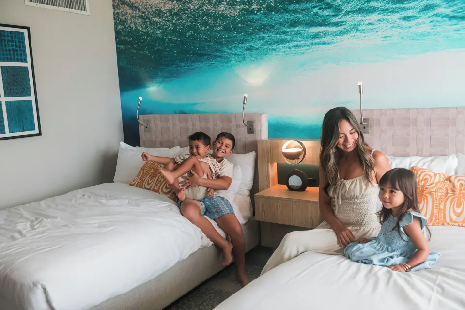 Two-bed Waikiki View room with bedside lighting at OUTRIGGER Waikiki Beachcomber Hotel.