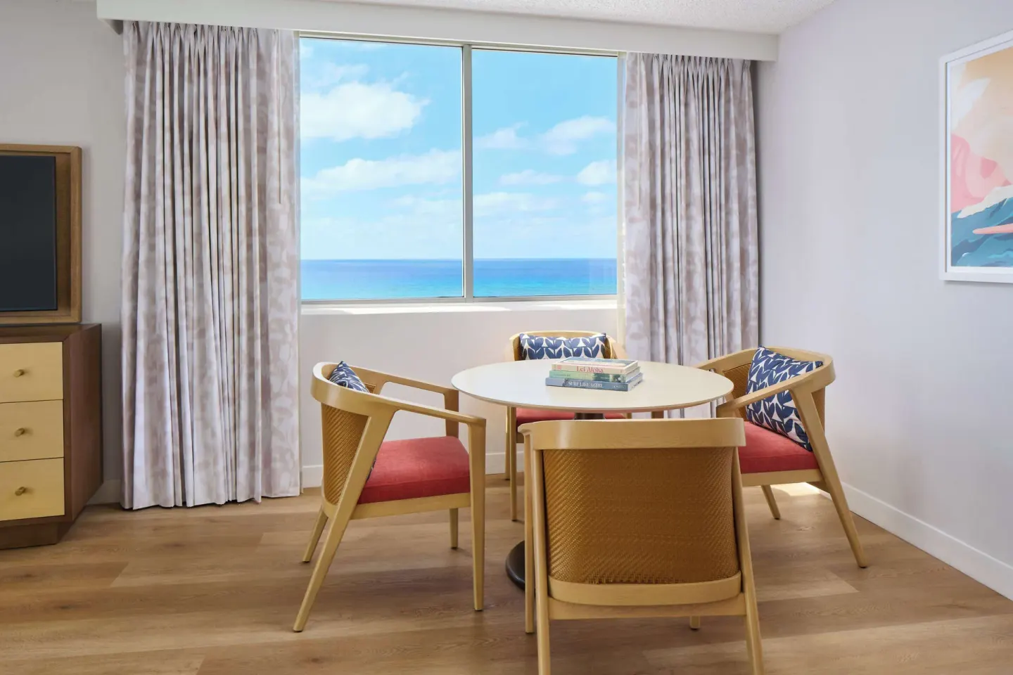 Ocean-view dining nook in a guest room at OUTRIGGER Waikiki Paradise Hotel.