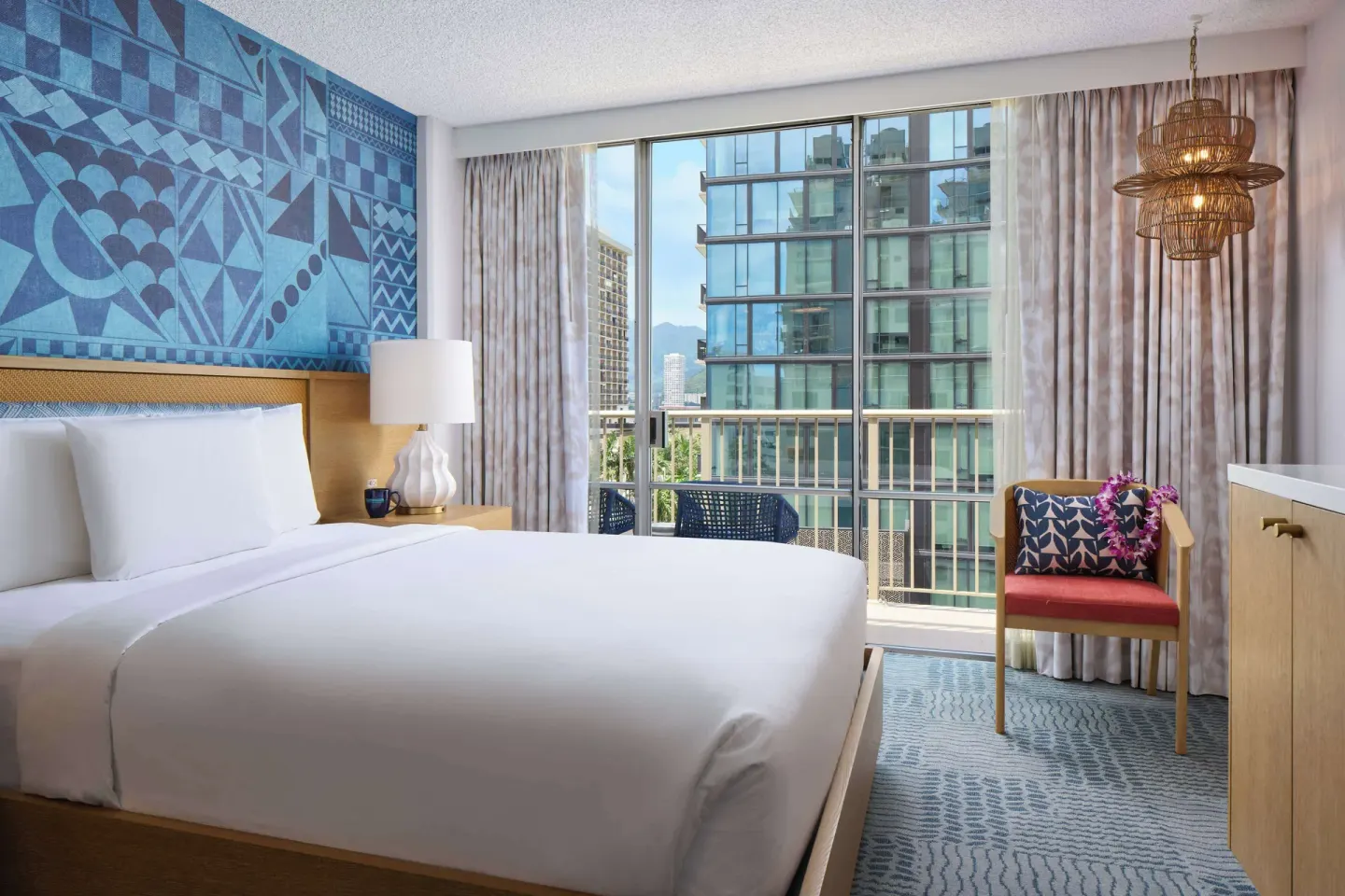 King room with balcony and city view at OUTRIGGER Waikiki Paradise Hotel.