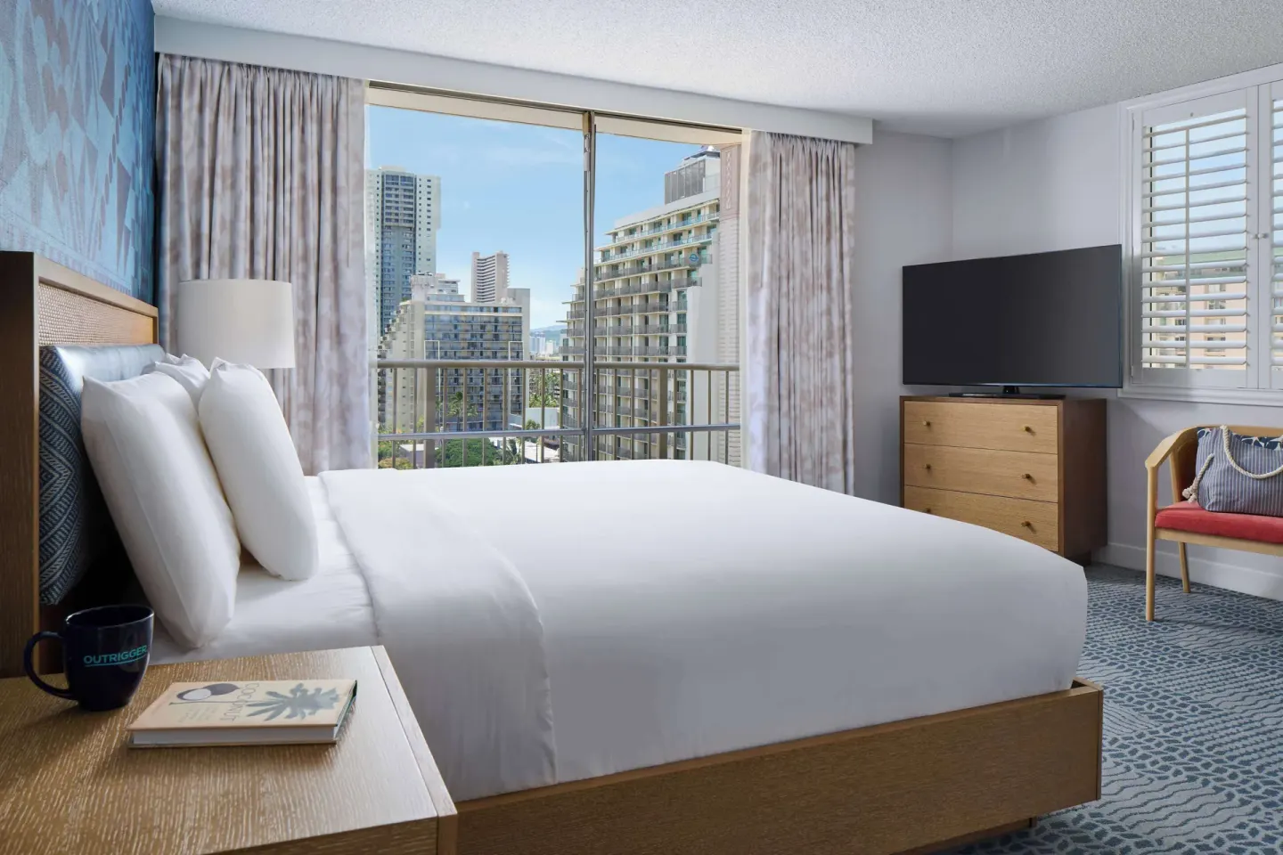 Studio king bed with balcony city view at OUTRIGGER Waikiki Paradise Hotel.