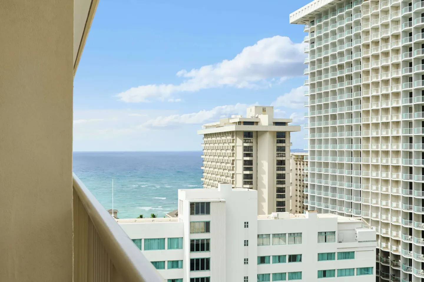Studio balcony view of ocean and nearby towers at OUTRIGGER Waikiki Paradise Hotel.