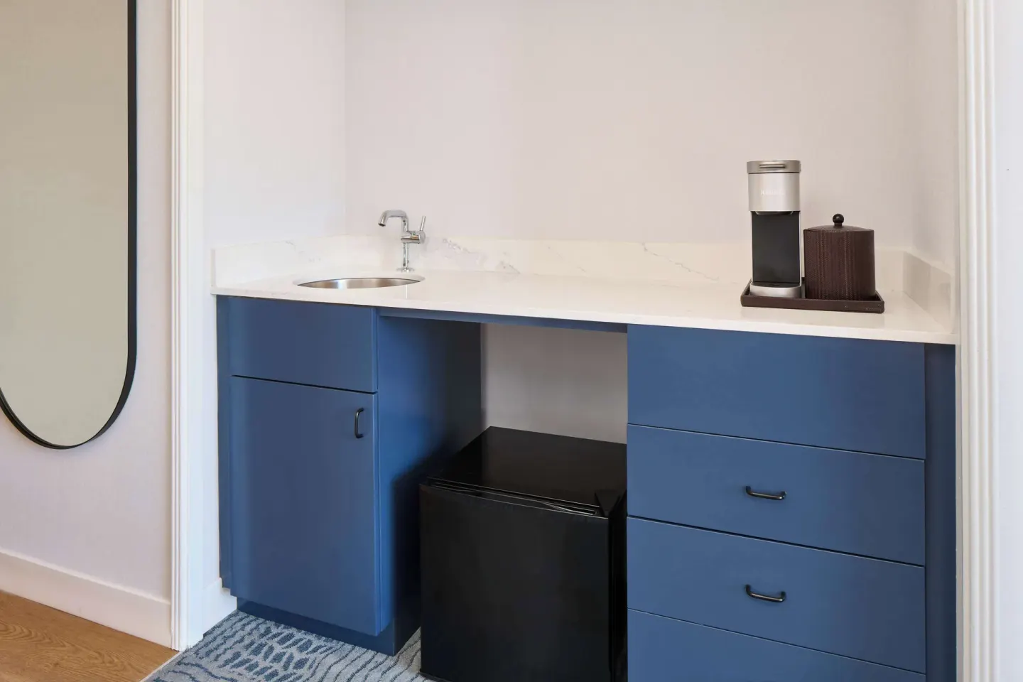 Studio wet bar with sink and refrigerator at OUTRIGGER Waikiki Paradise Hotel.