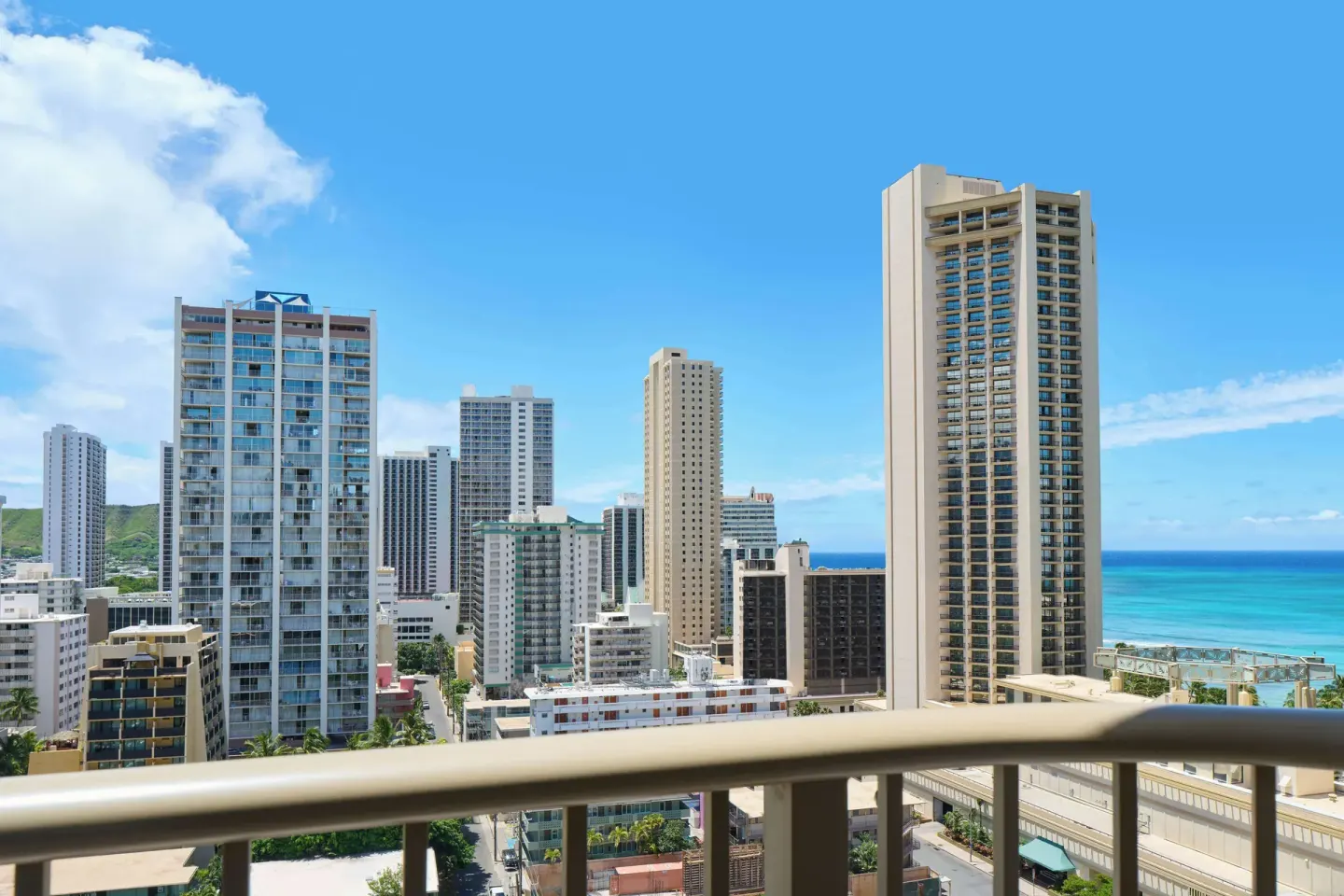 Balcony view of Waikiki towers and ocean from OUTRIGGER Waikiki Paradise Hotel.