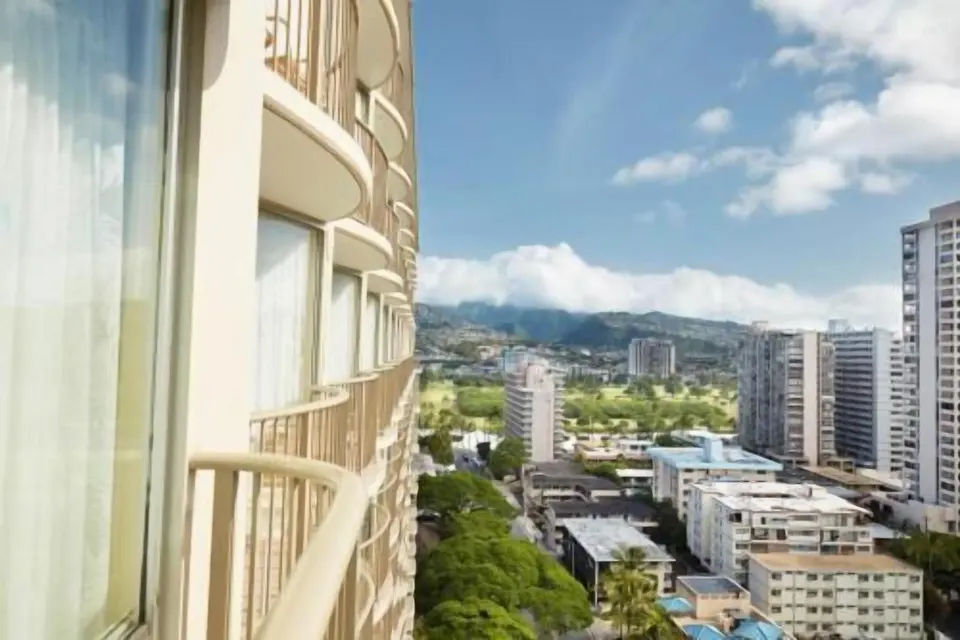 Balcony view of neighboring towers and mountains from OUTRIGGER Waikiki Paradise Hotel.