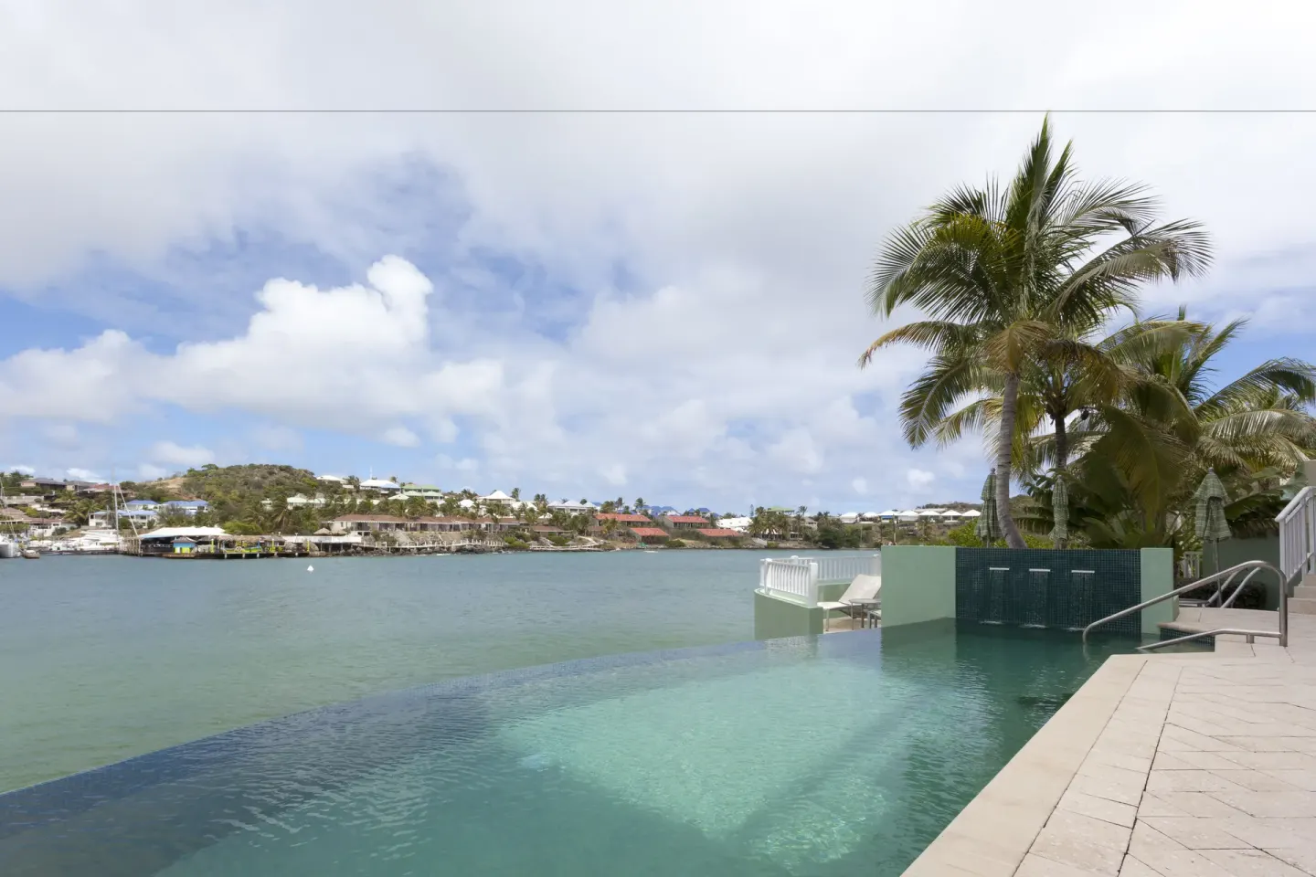 Infinity pool beside the bay at Oyster Bay Beach Resort.