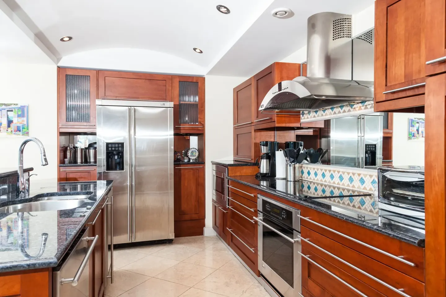 Full kitchen with stainless appliances at Oyster Bay Beach Resort.
