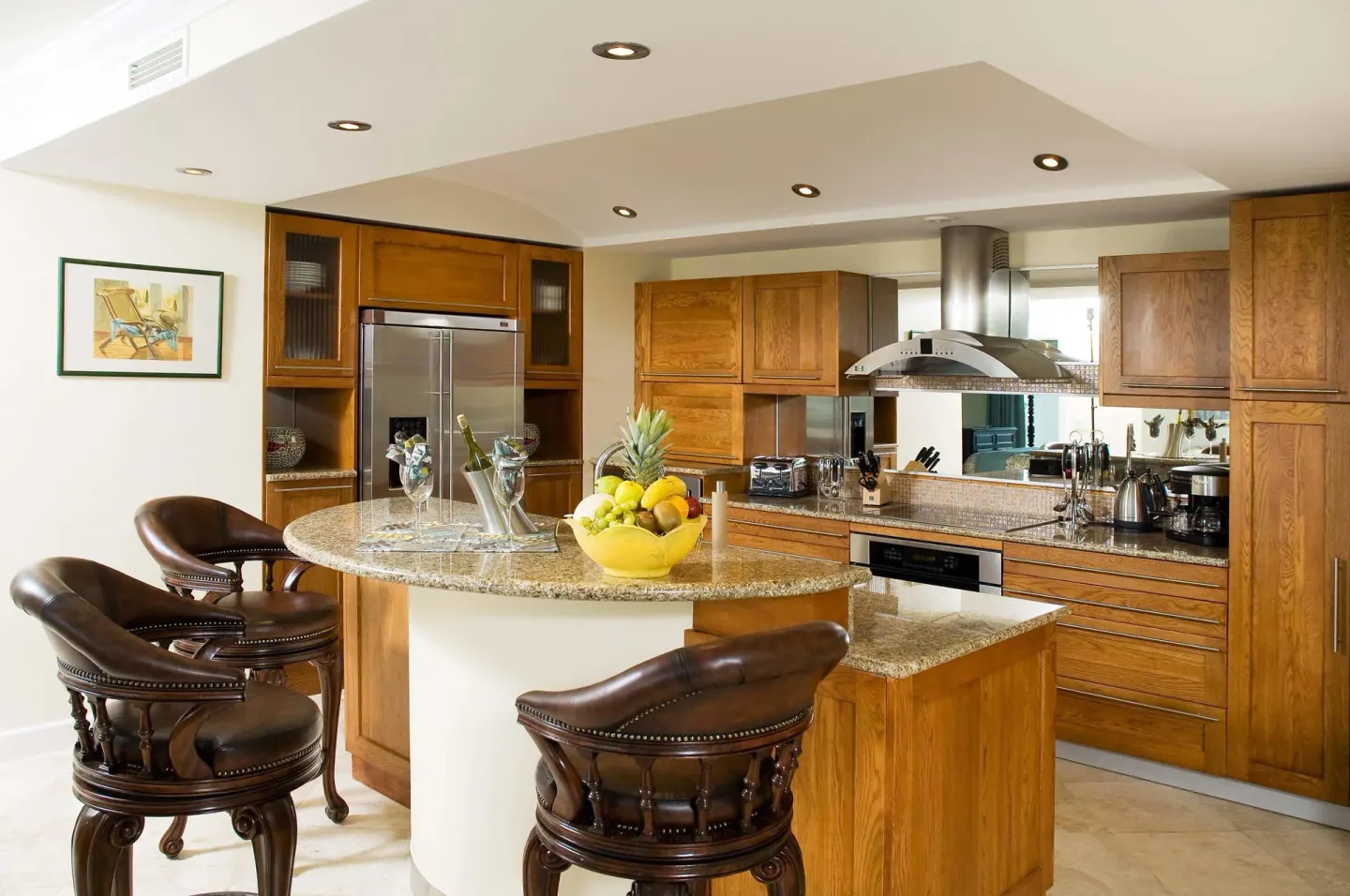 Suite kitchen with breakfast bar and leather stools at Oyster Bay Beach Resort.