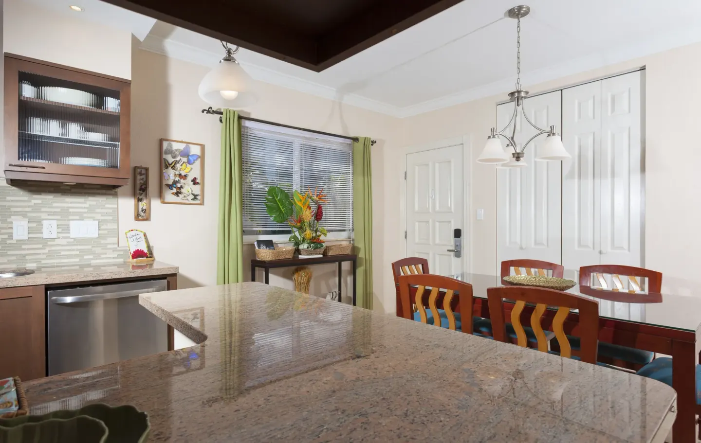 Kitchen and dining area with granite counter at Oyster Bay Beach Resort.
