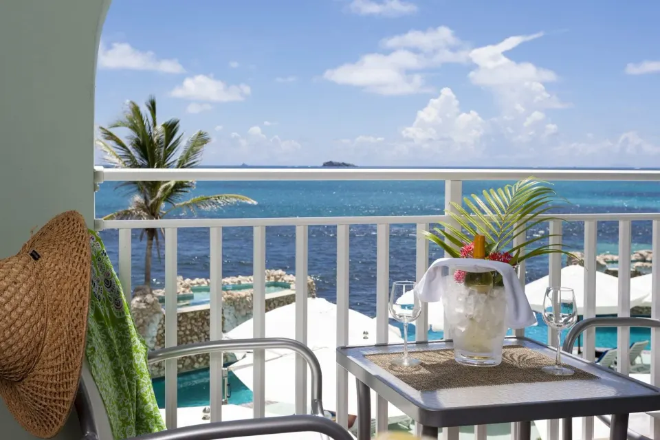 Deluxe Courtyard Loft balcony with ocean view at Oyster Bay Beach Resort.