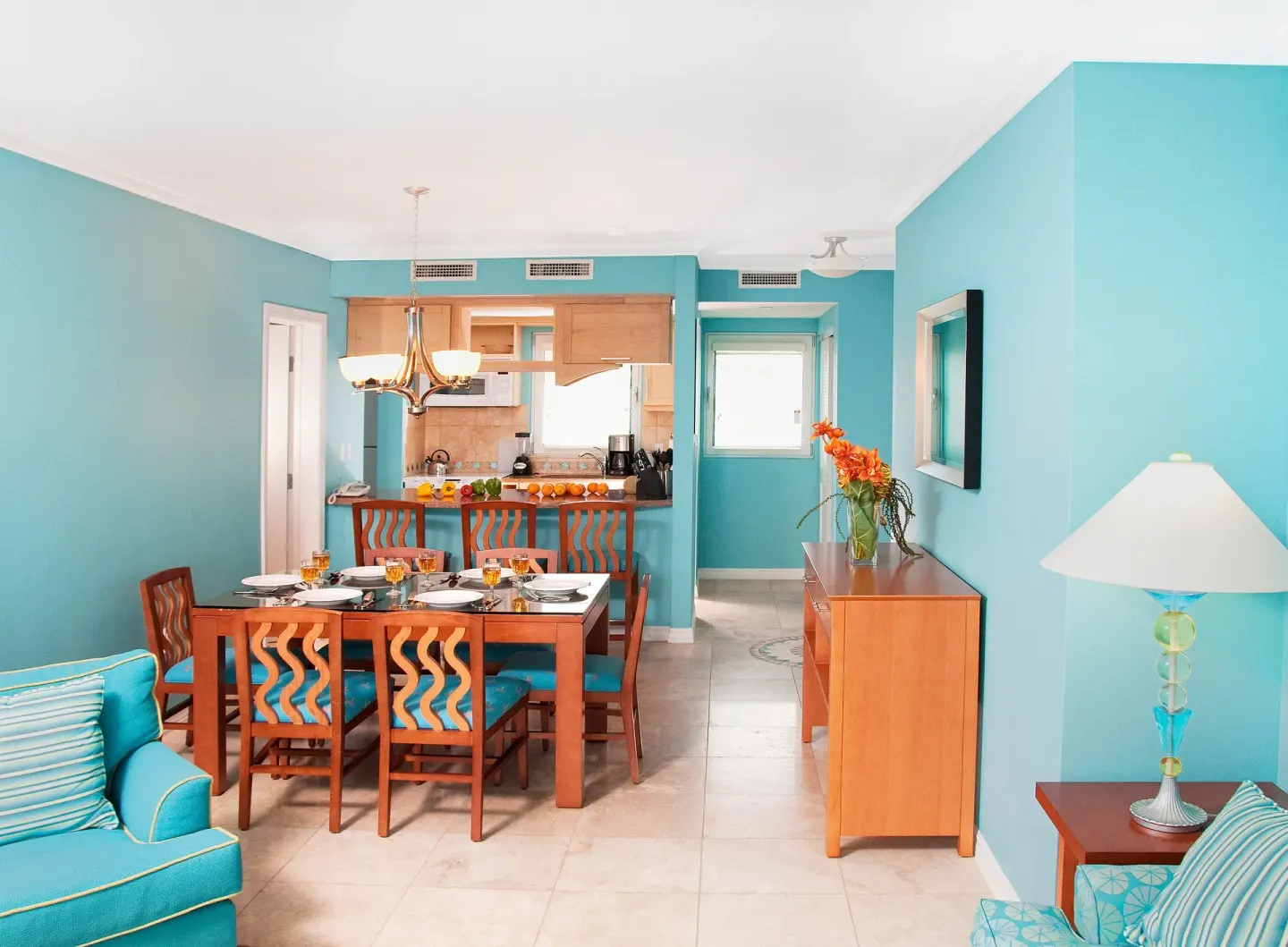 Oceanfront one-bedroom suite dining area and kitchen at Oyster Bay Beach Resort.