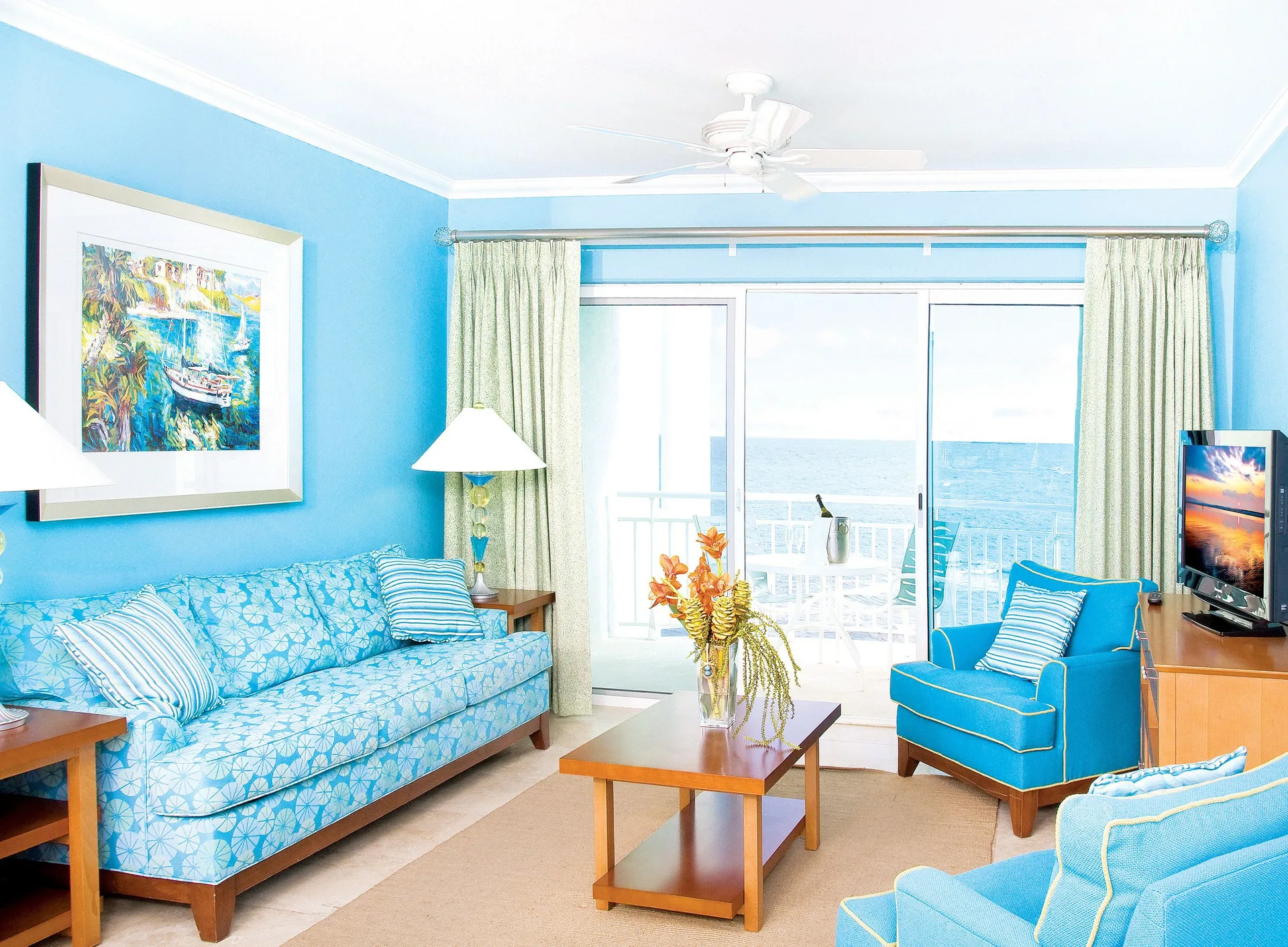 Two-Bedroom Suite lounge and balcony at Oyster Bay Beach Resort with oceanfront views on St. Maarten's Dawn Beach.