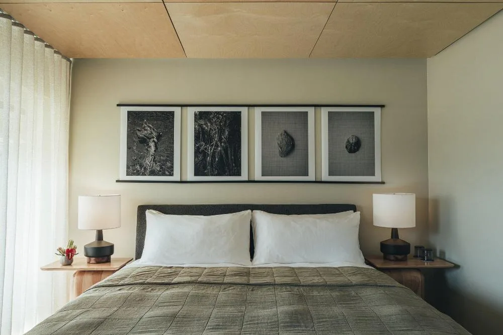 City View Room king bed with framed wall art and bedside lamps at PACIFIC 19 Kona.