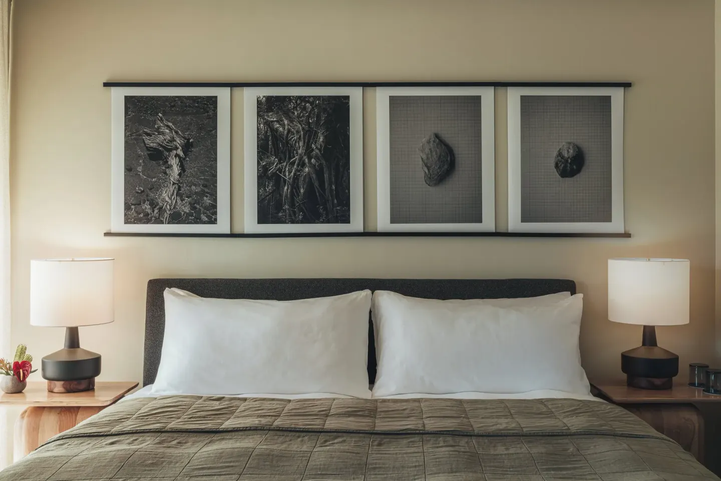 Close view of a Pool View room king bed with lamps and wall art at PACIFIC 19 Kona.
