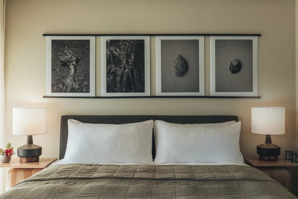 Close view of a Pool View room king bed with lamps and wall art at PACIFIC 19 Kona.