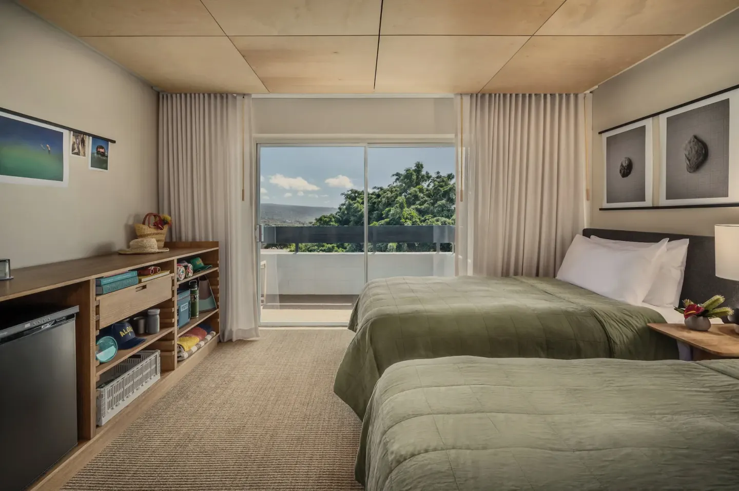 Pool View room with two beds, balcony doors, and shelving at PACIFIC 19 Kona.