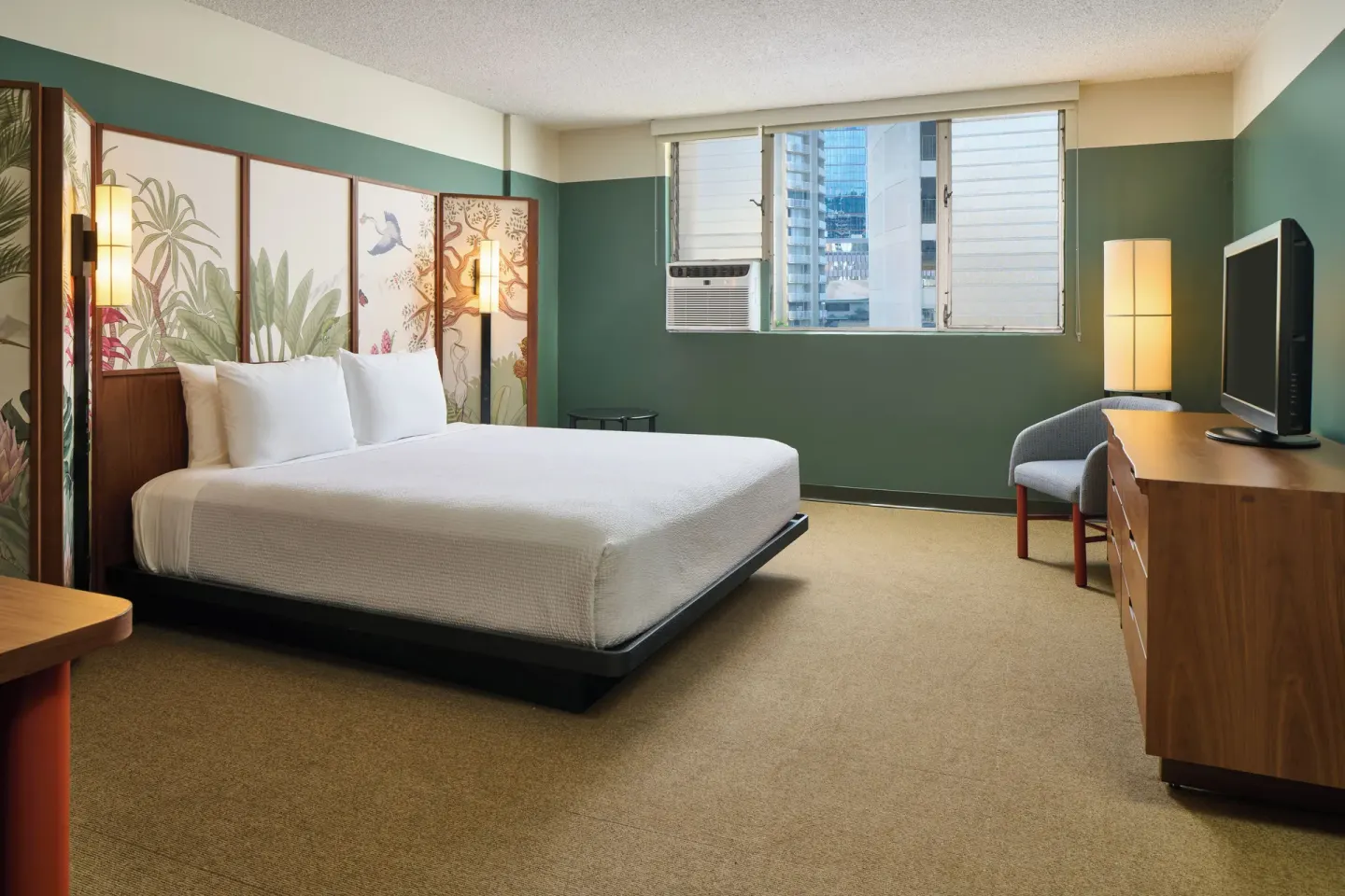 City View room with a king bed, wall art, desk, TV, and window at Pagoda Hotel.