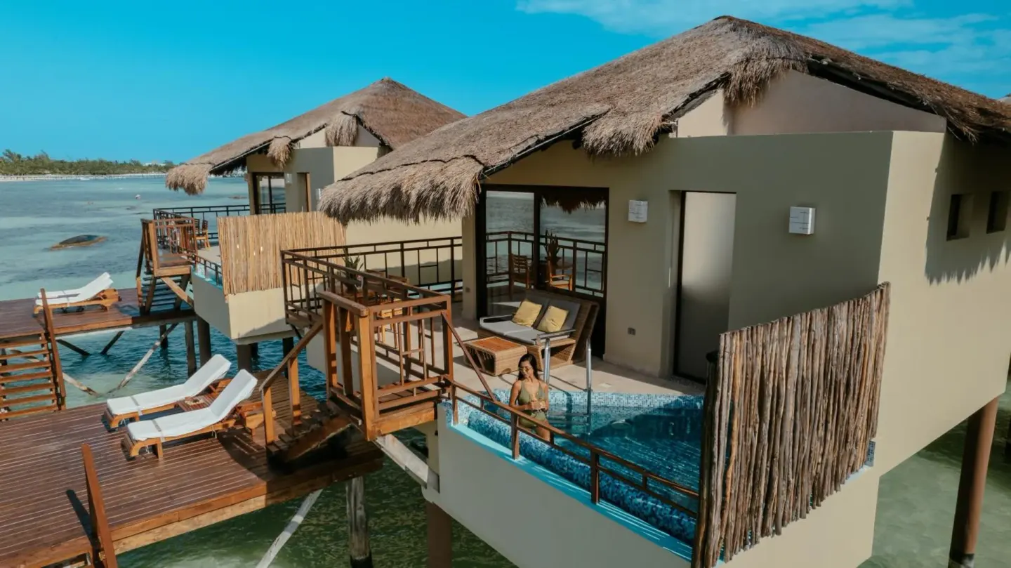 Overwater bungalow with plunge pool and deck at Palafitos Overwater Bungalows.
