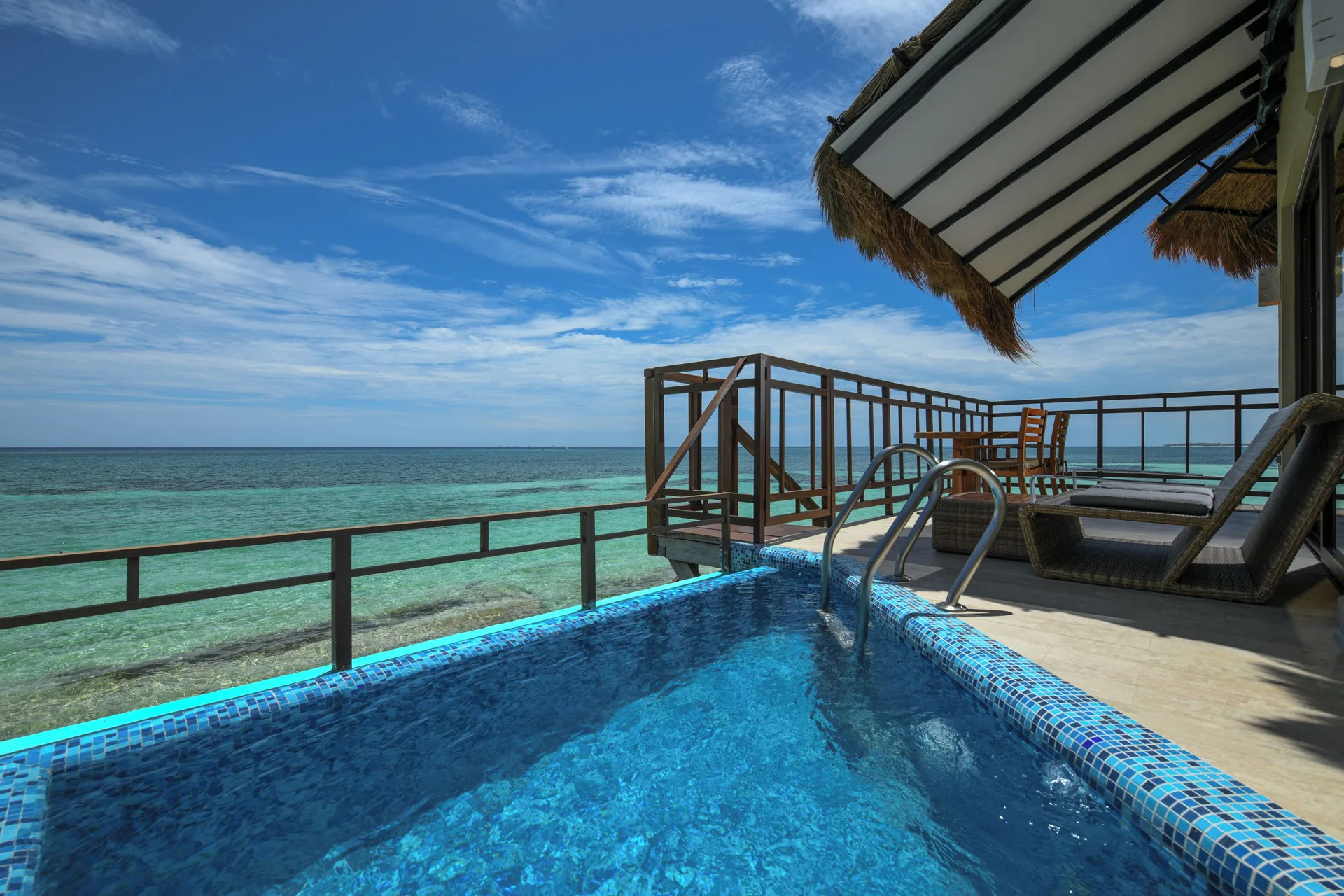 Private plunge pool deck facing the sea at Palafitos Overwater Bungalows.