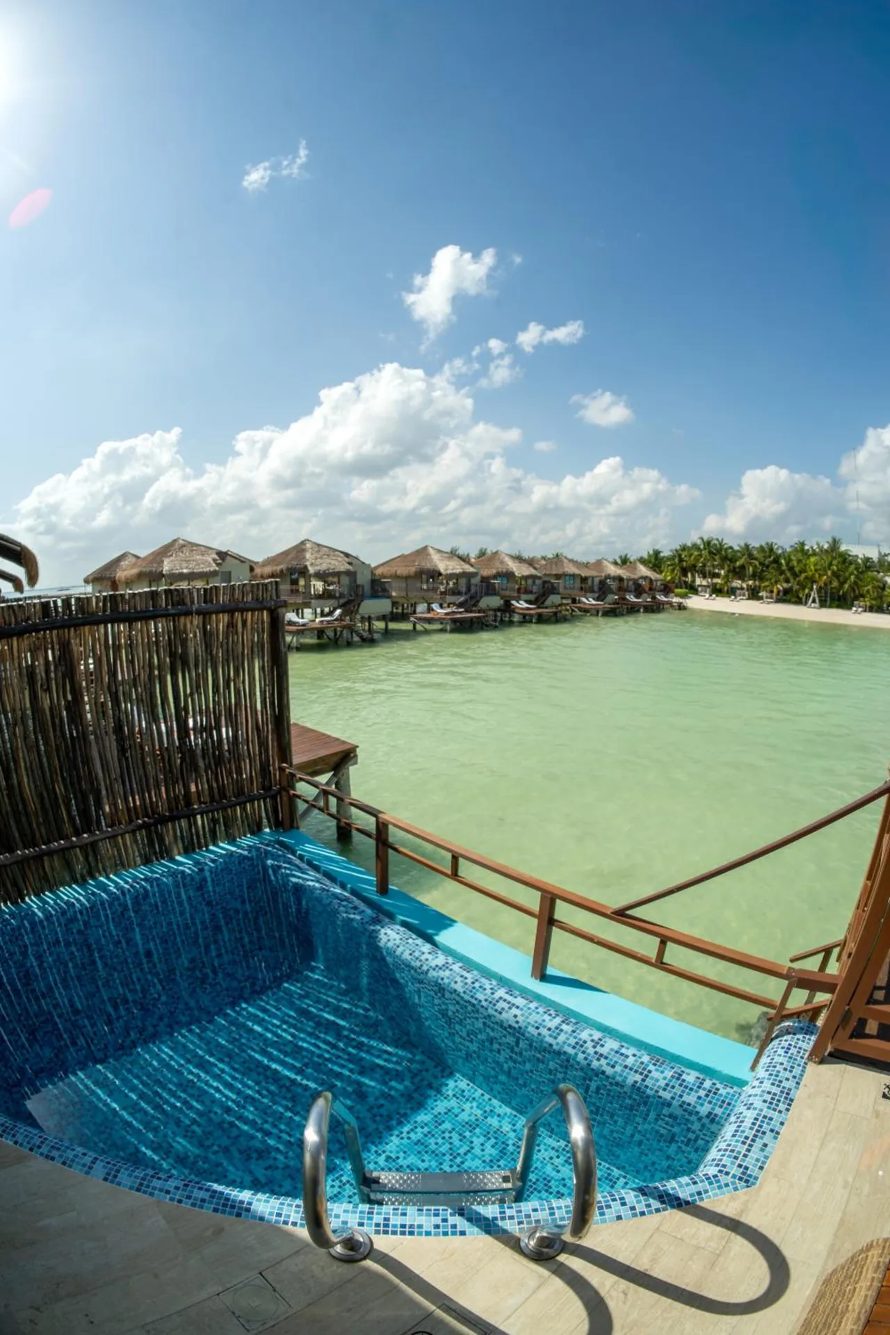 Private plunge pool and lagoon view at Palafitos Overwater Bungalows.