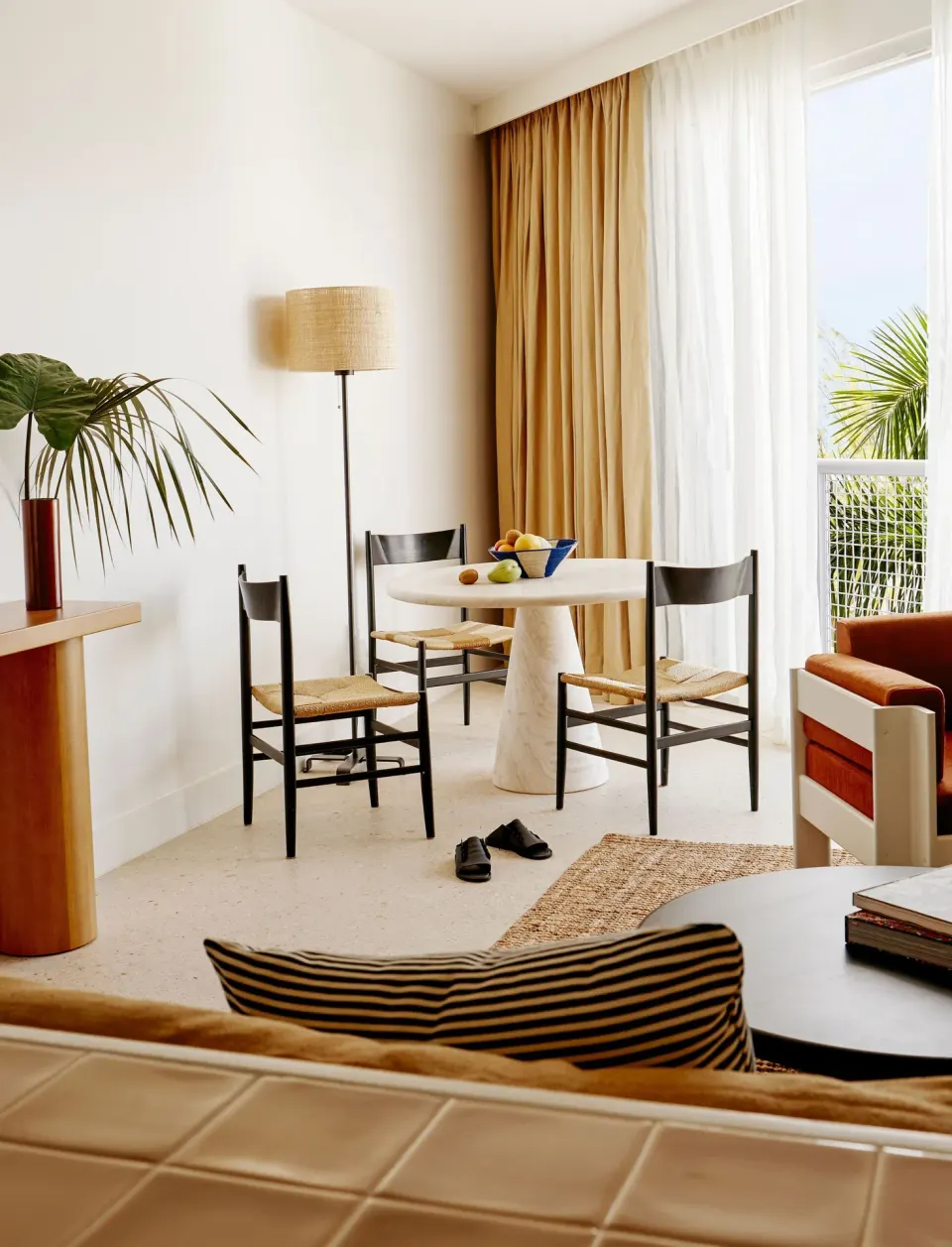 Junior suite living area with balcony and ocean view at Palm Heights.