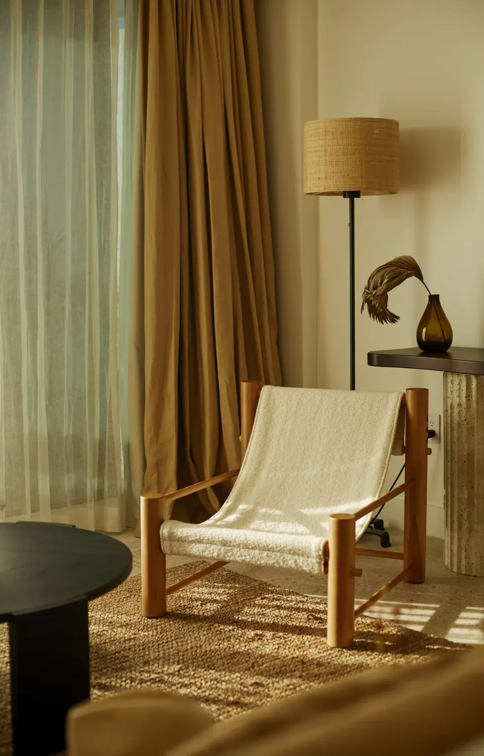 Relaxing seating area with a woven lounge chair and floor lamp at Palm Heights.