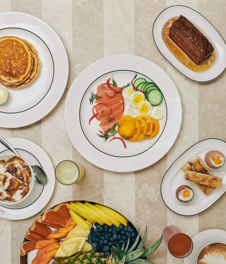 Breakfast spread with smoked salmon, pancakes and fruit at Palm Heights