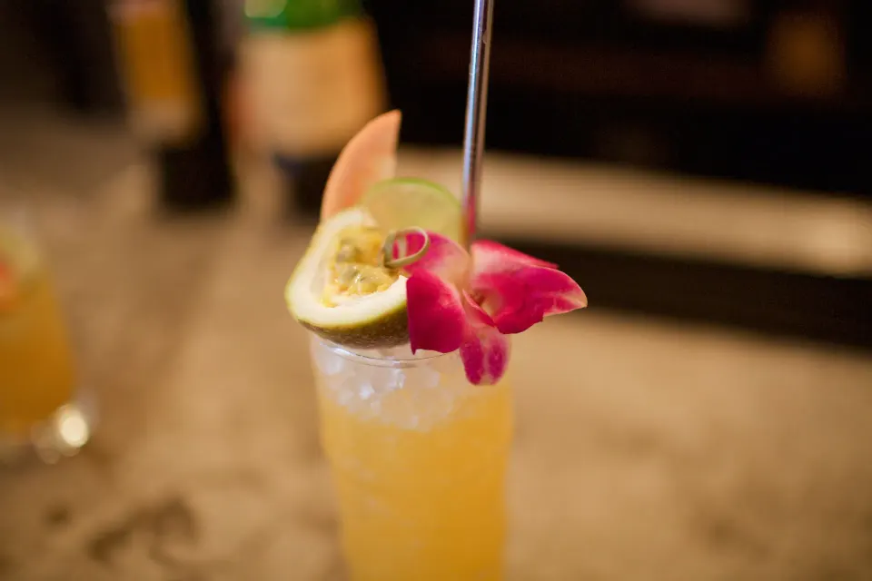 Tropical cocktail with orchid garnish served at Palm Heights.