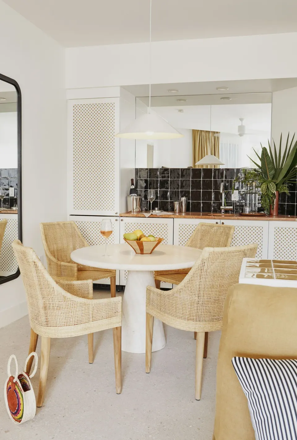 Dining area and kitchenette in a Deluxe Multiple Beds Ocean View Suite at Palm Heights