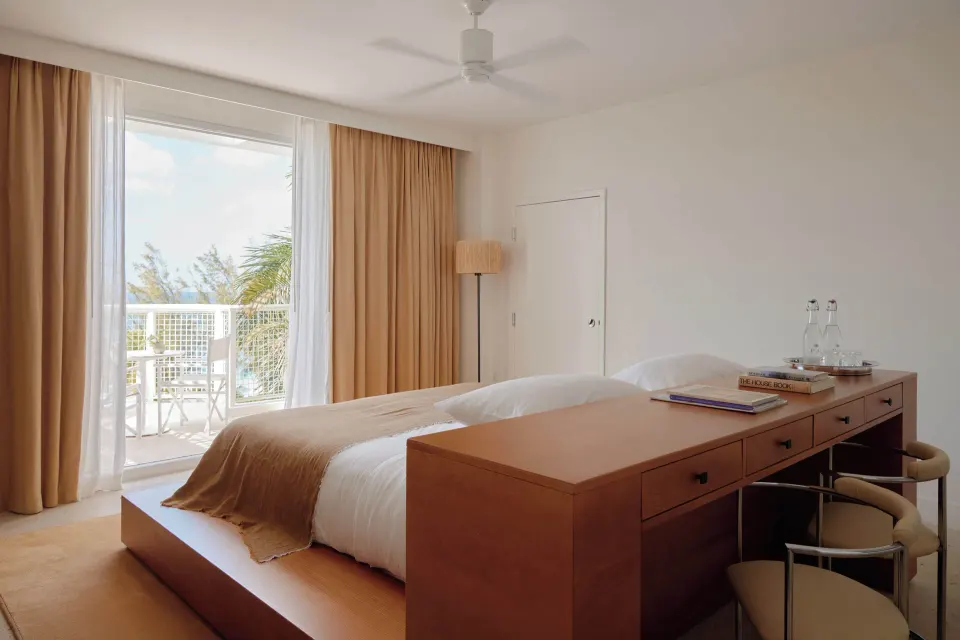 Bedroom with platform bed and balcony at Palm Heights