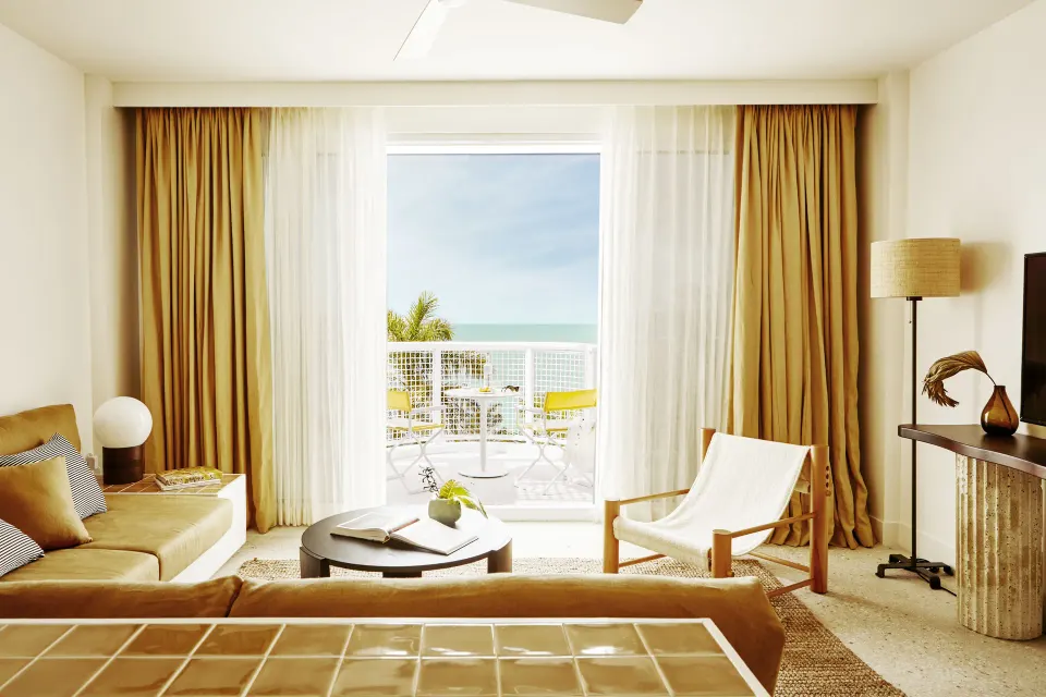 One Bedroom Oceanfacing Penthouse Suite living area with balcony view at Palm Heights