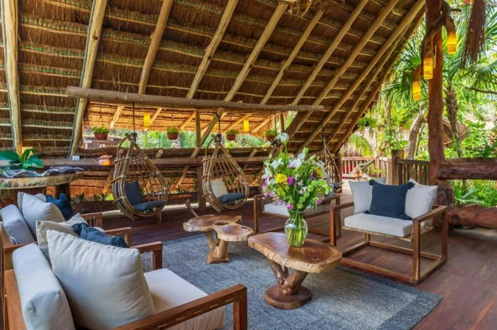 Kanan Tulum adults-oriented bohemian design hotel with woven wood architecture and beachfront setting in Tulum, Mexico.