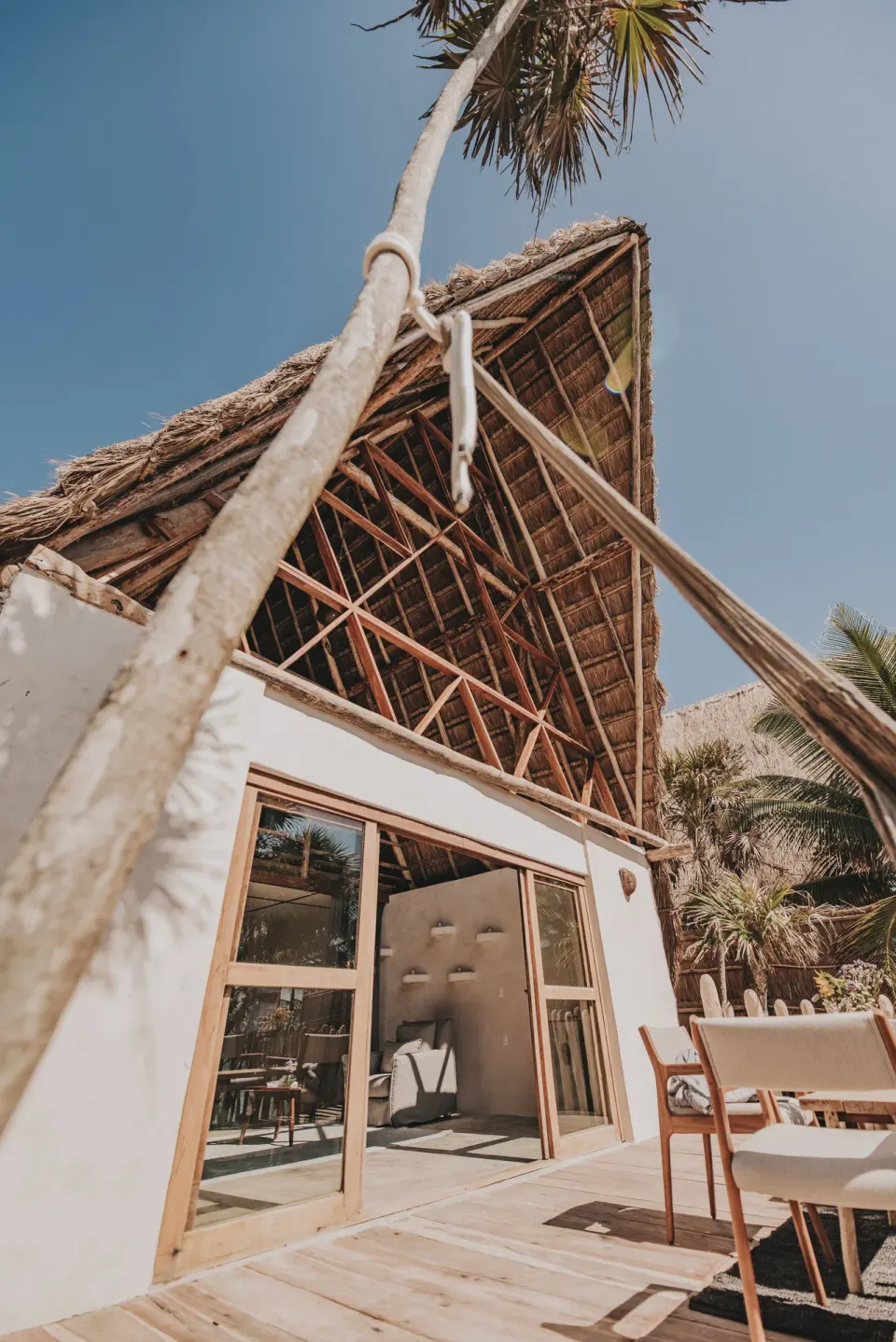 Exterior deck and thatched upper structure of a Private Pool room at Papaya Playa Project.