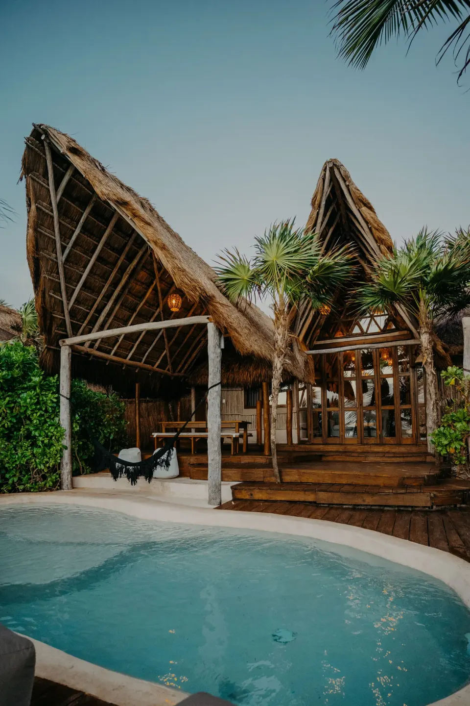Private plunge pool and thatched Casa Coco structure at Papaya Playa Project.