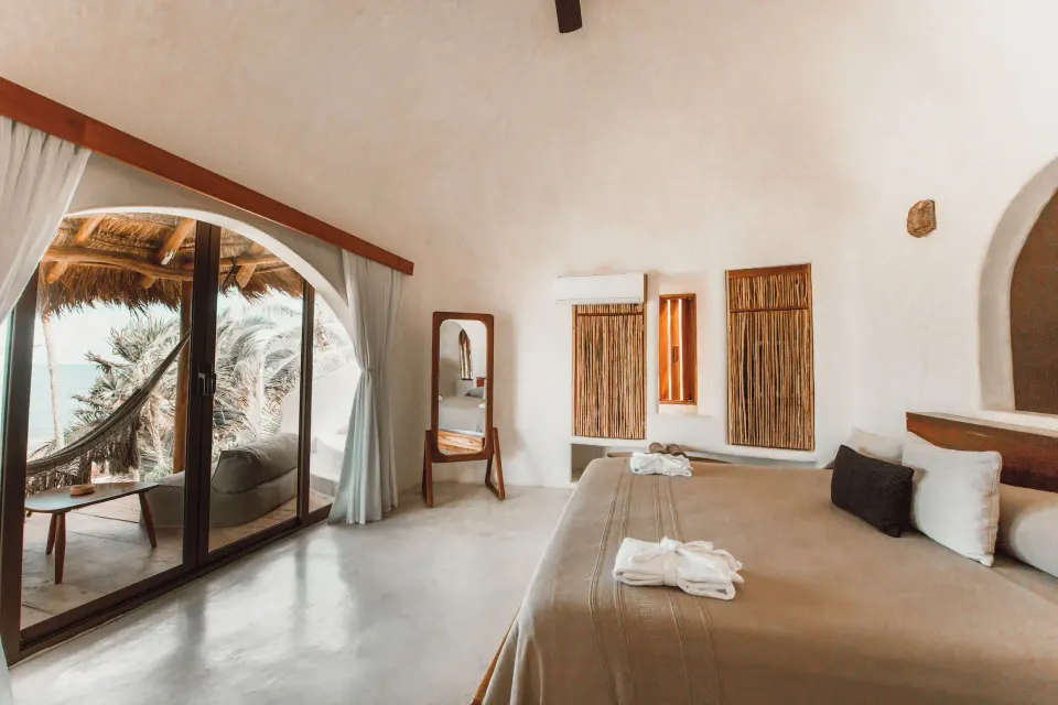 Casita ocean view room with king bed and balcony hammock at Papaya Playa Project