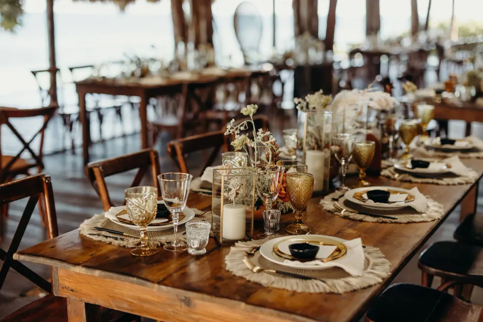Decorated wooden dining table set for a meal at Papaya Playa Project.