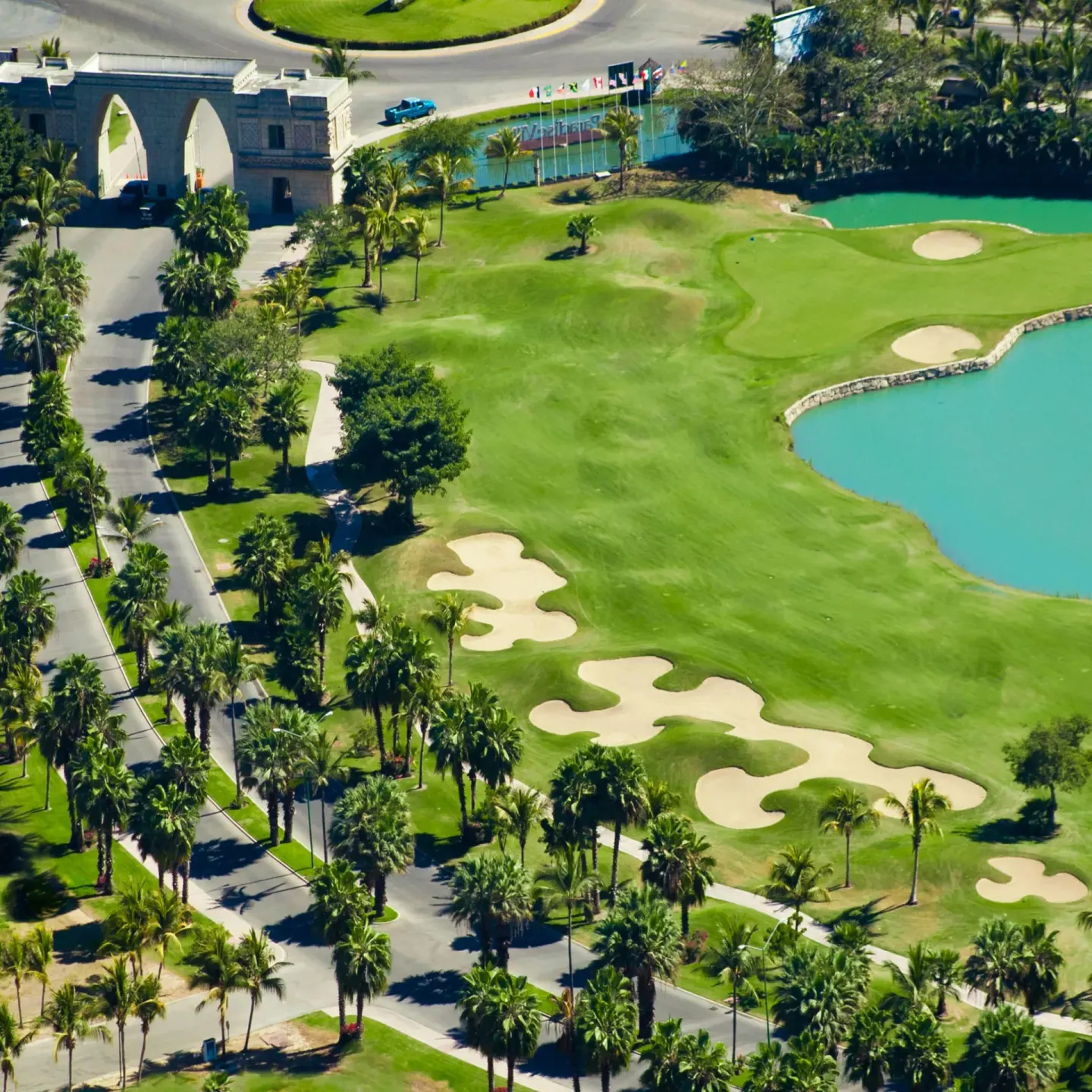 Aerial view of a golf course and palms at Paradise Village Beach Resort and Spa.