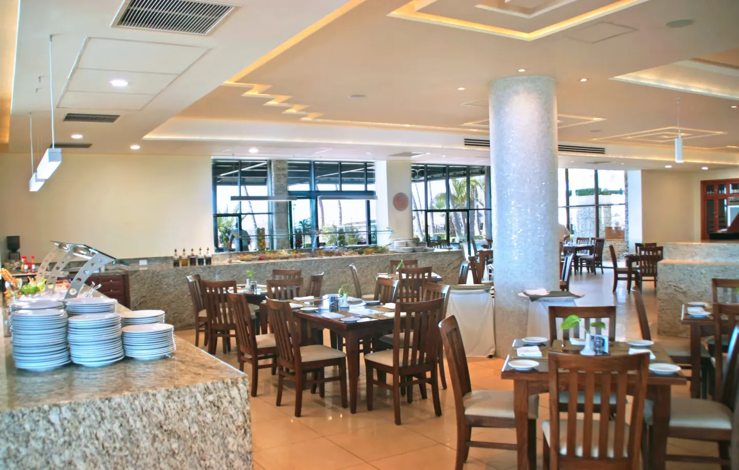 Buffet dining room with set tables at Paradise Village Beach Resort and Spa.