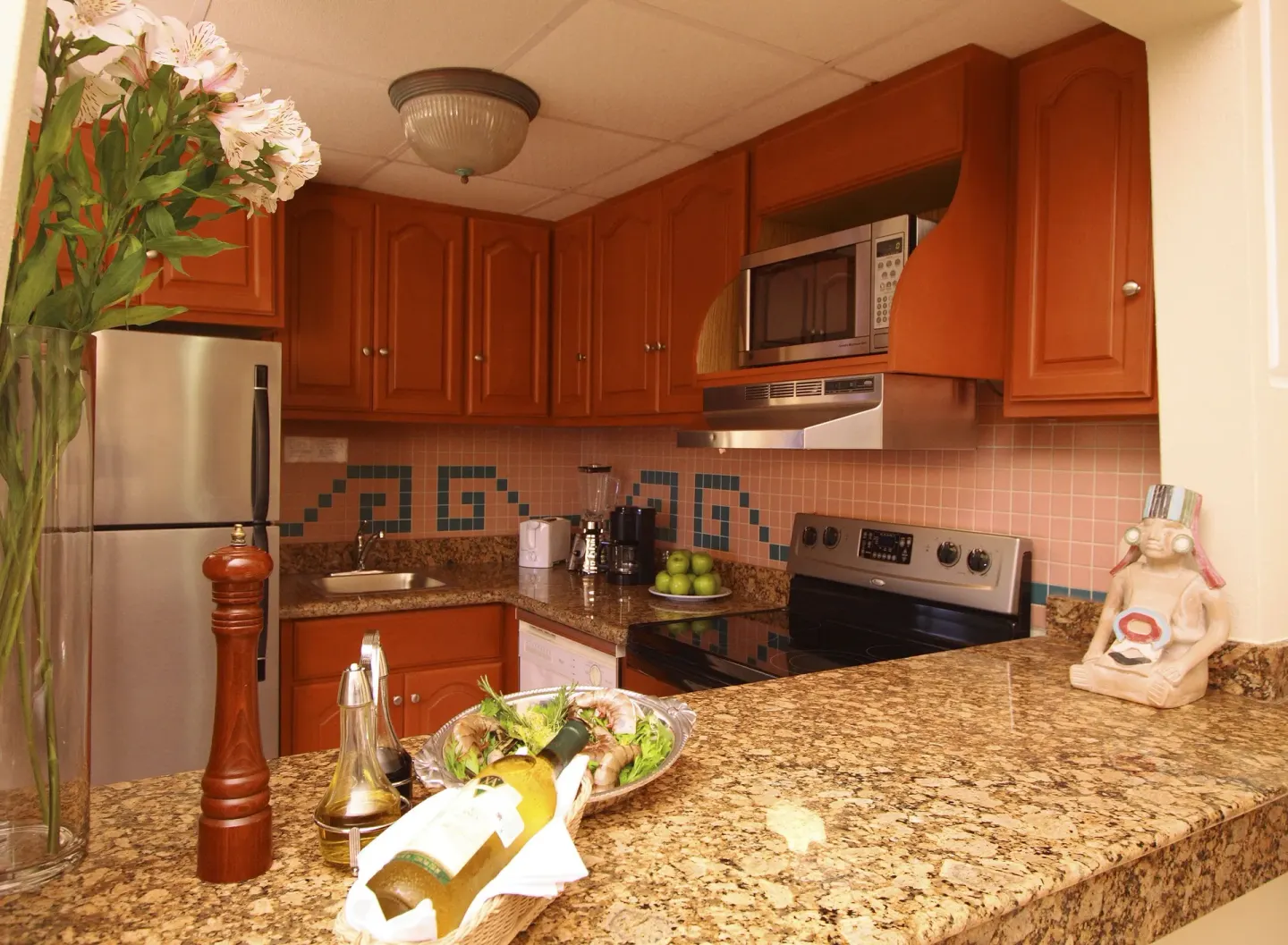 Standard Studio Suite kitchen with granite counter at Paradise Village Beach Resort and Spa.