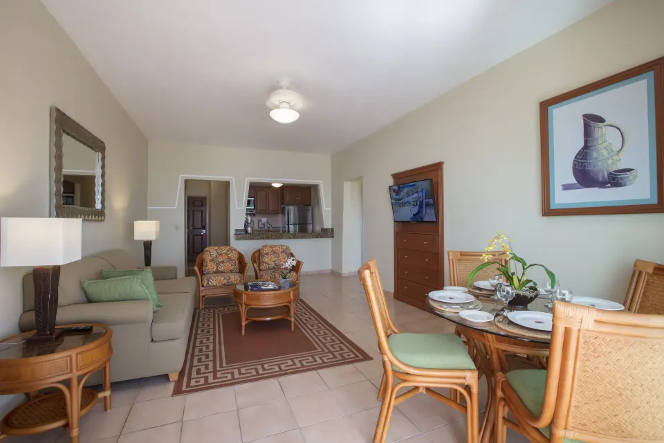 Standard Suite living room with dining table at Paradise Village Beach Resort and Spa.