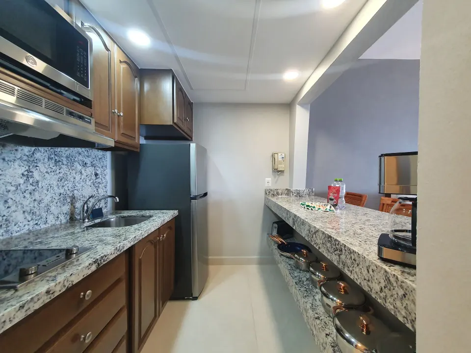 Superior Studio Suite kitchenette with granite counters at Paradise Village Beach Resort and Spa.
