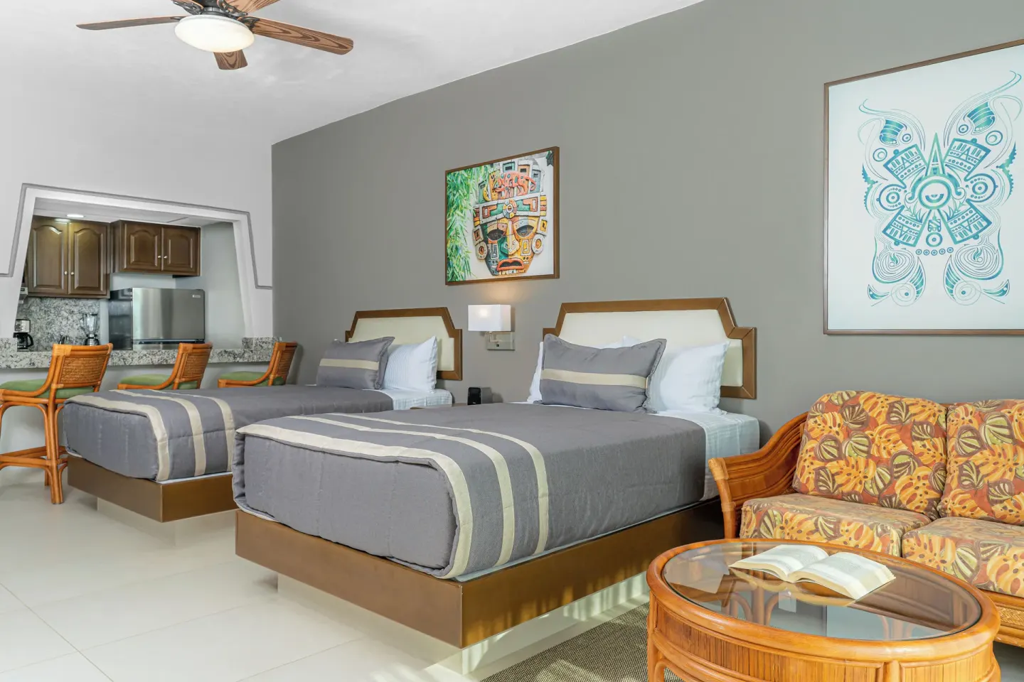 Superior Studio Suite with two beds and sitting area at Paradise Village Beach Resort and Spa.