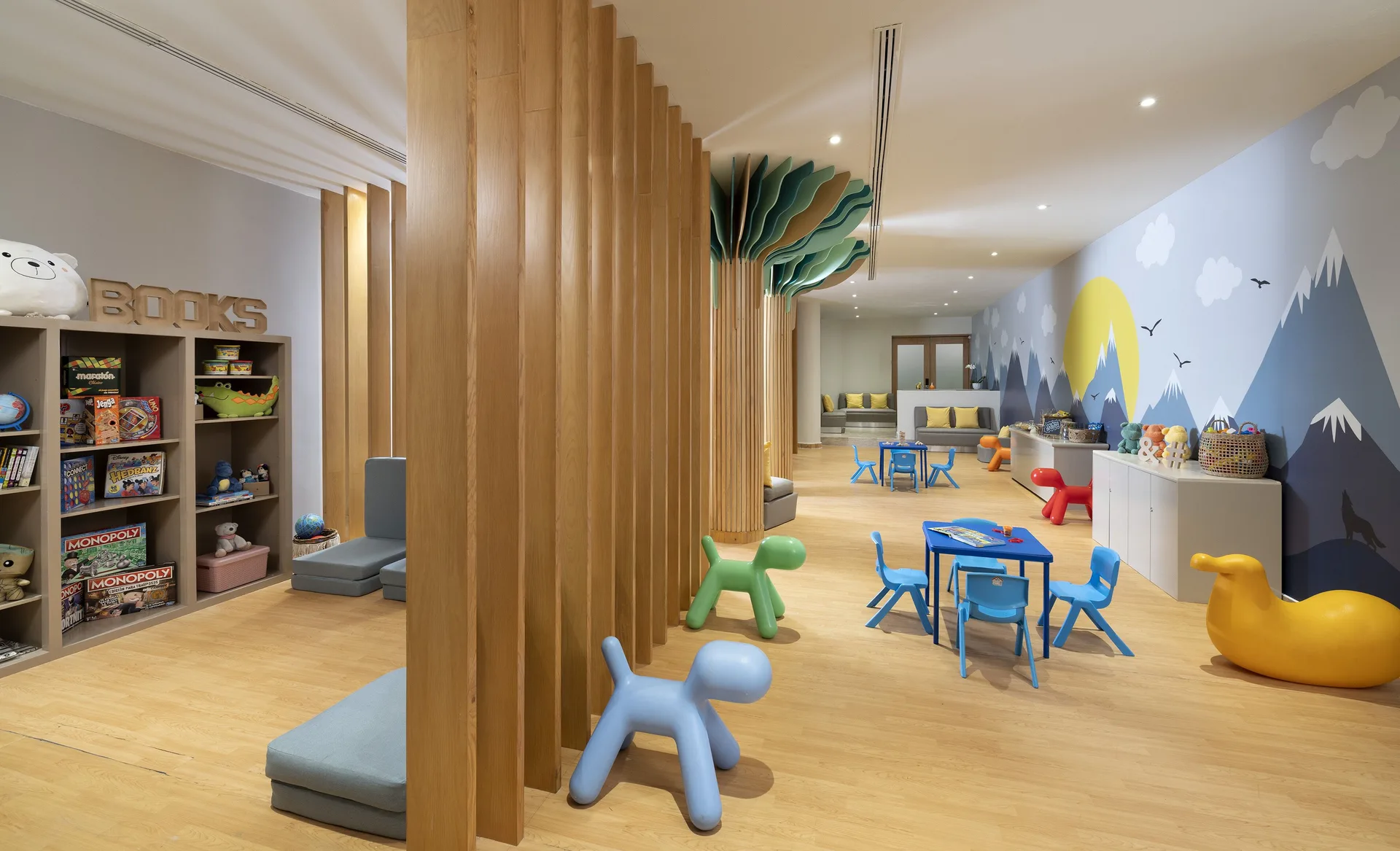 Children's playroom with toys, books and small tables at Paradisus Cancún.