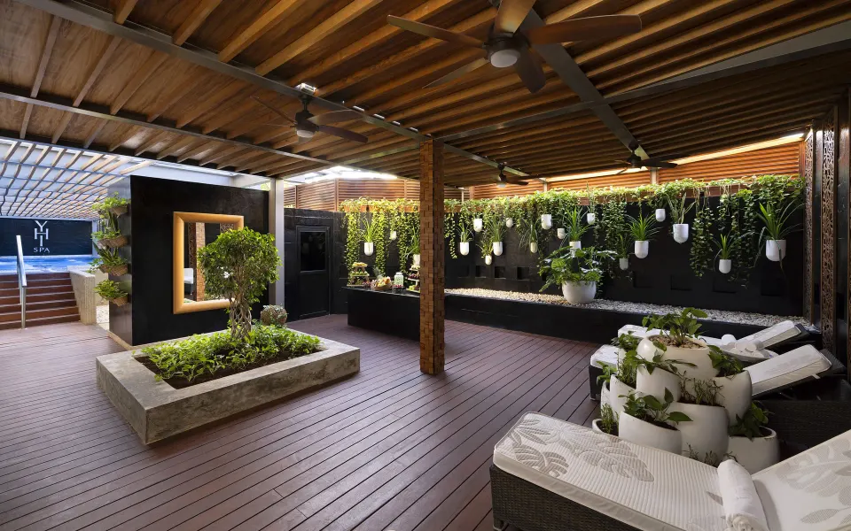 Spa relaxation terrace with loungers, greenery, and hanging planters at Paradisus Cancún.