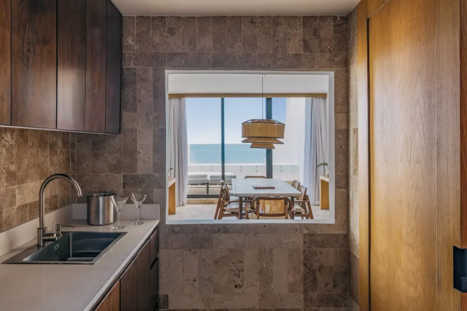 Governor Suite wet bar with sink and interior window at Paradisus Cancún.
