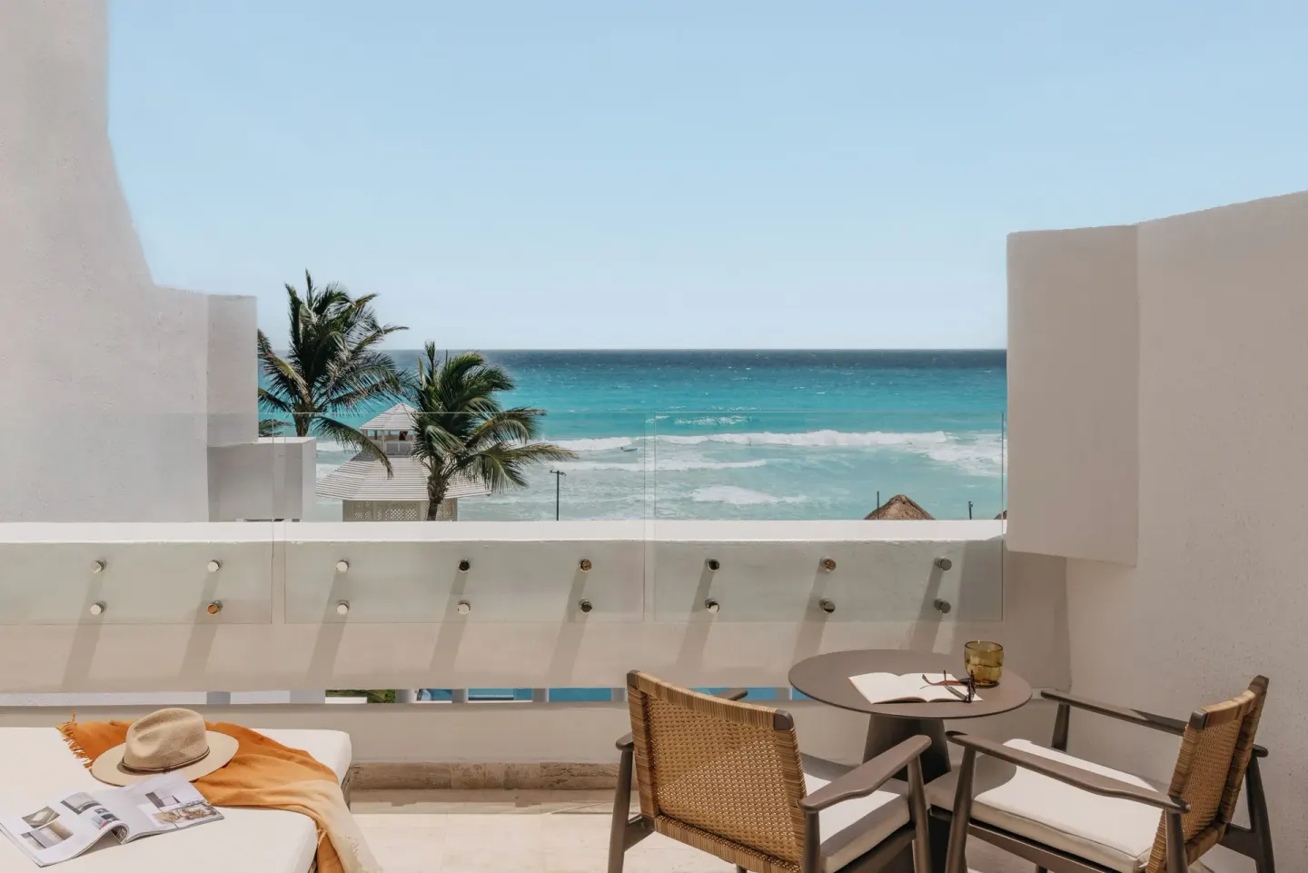 Ocean view balcony seating for The Reserve Adults Only Junior Suite at Paradisus Cancún.