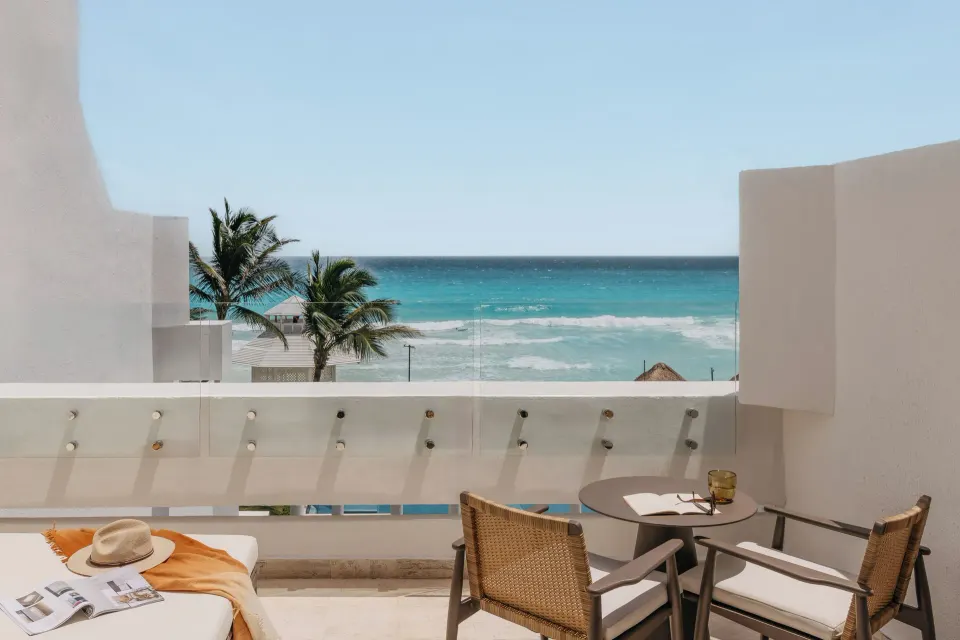 Ocean view balcony seating for The Reserve Adults Only Junior Suite at Paradisus Cancún.