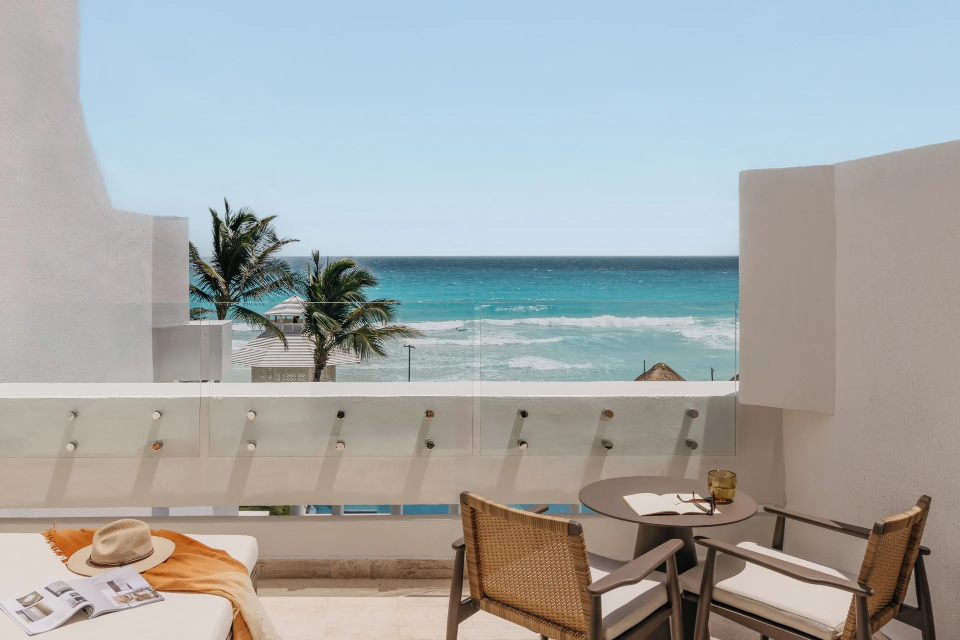 Ocean view balcony seating for The Reserve Adults Only Junior Suite at Paradisus Cancún.